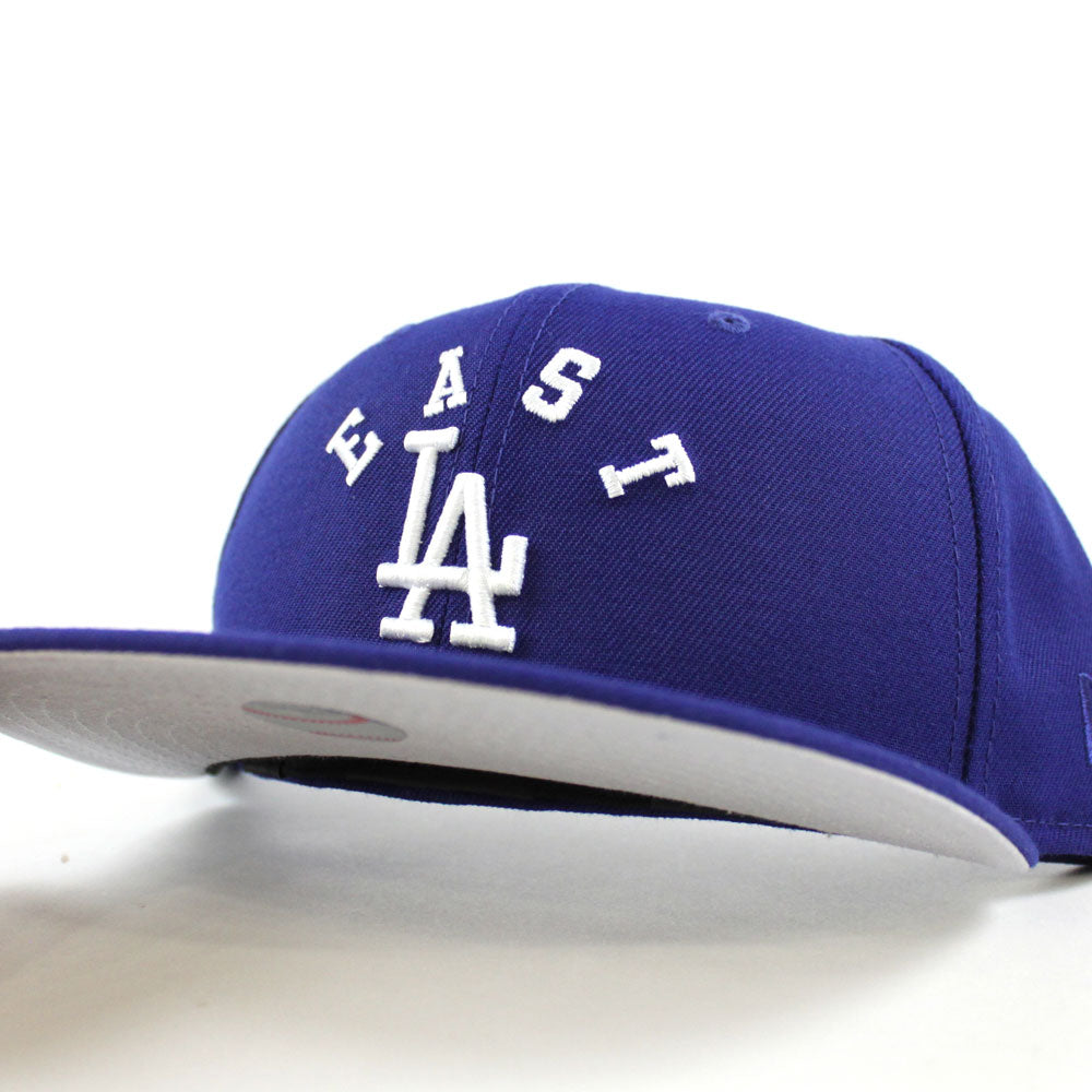 https://www.ecapcity.com/cdn/shop/products/East-Los-Angeles-Dodgers-New-Era-59Fifty-Fitted-Hat-_Blue-Gray-Under-Brim_-1.jpg?v=1605038993
